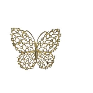 Elegant gold butterfly brooch with intricate design. Vintage Circa 80's